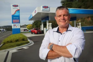 Barry Sheridan standing in front of NPD's St Vincent St self-serve fuel station