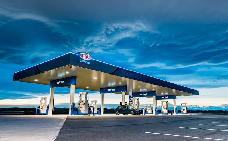 NPD Rolleston self-serve fuel station at dusk with a vehicle refuelling under the canopy